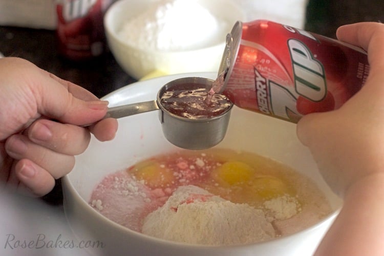 ingredients being mixed in white bowl 