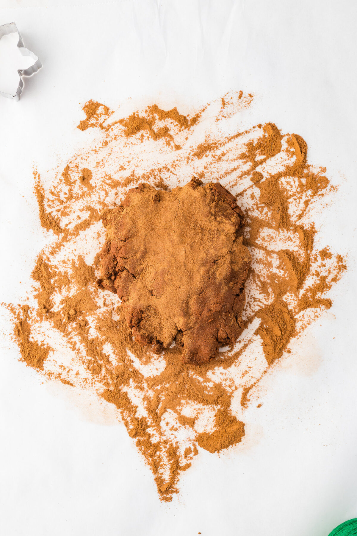 dough on a surface sprinkled with cinnamon