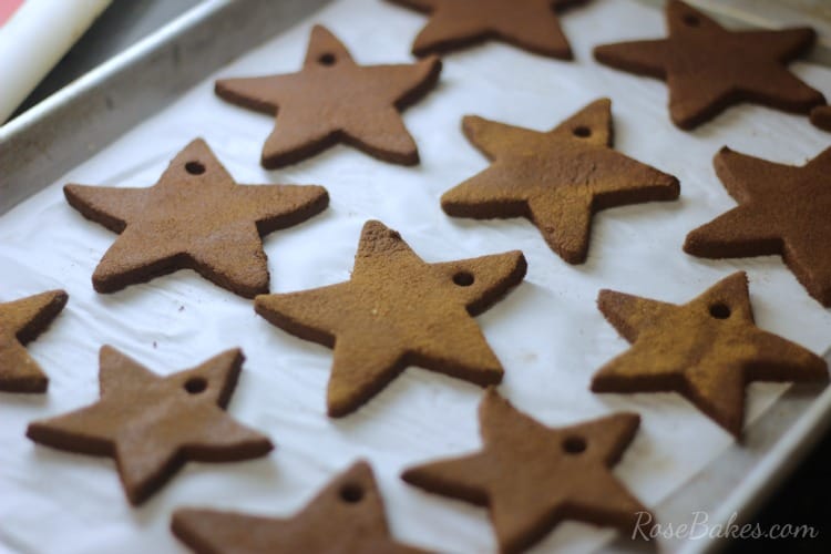 Easy Baked Cinnamon Ornaments cooling on a cookie sheet