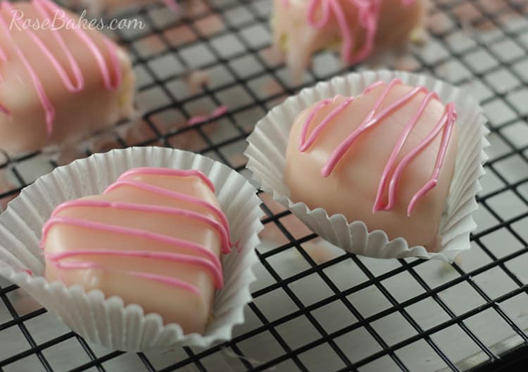 Heart Petit Fours in wrappers on cooling rack