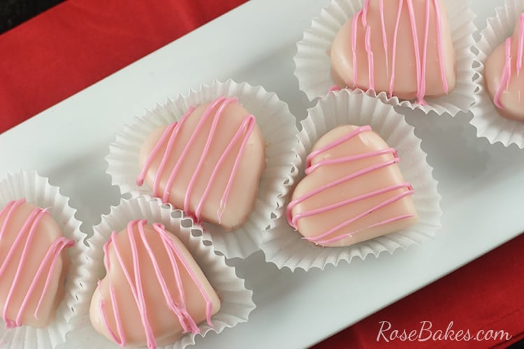 Valentines Petit Fours in liners on a white platter
