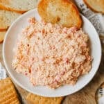Homemade Pimento Cheese in a white bowl with a slice of toasted bread