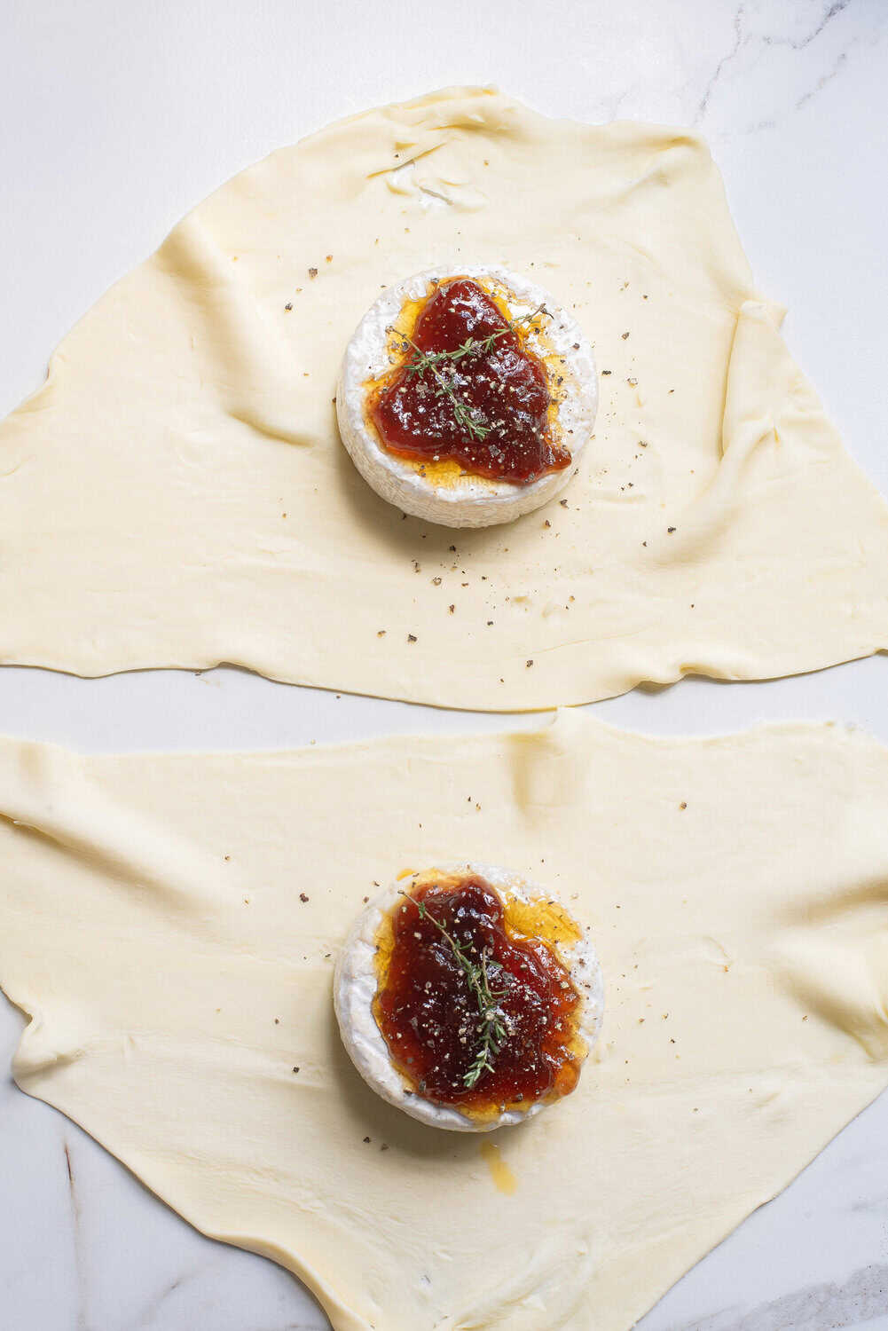 brie puff pastry with honey and jam plus cracked black pepper