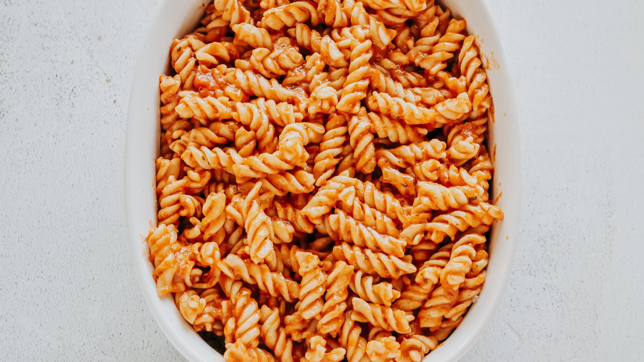 pasta with pizza sauce over ground beef and cream cheese