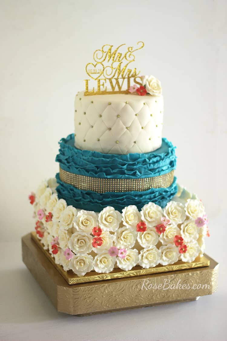 Teal & Coral Wedding Cake with gold rhinestones, gold dragees, and gold Mr. & Mrs. topper.