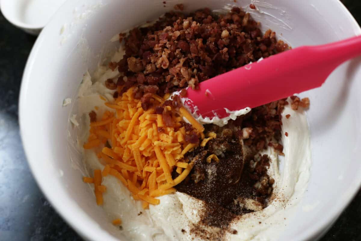seasonings plus bacon and cheddar cheese added to cream cheese mixture