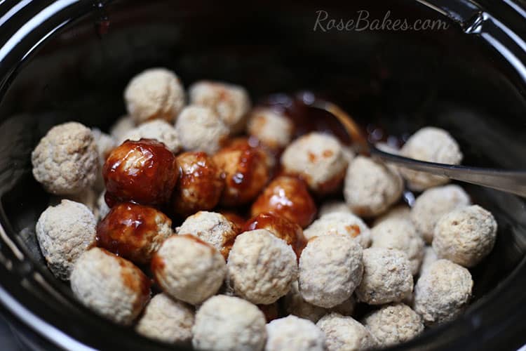 mixing-meatballs-with-sauce