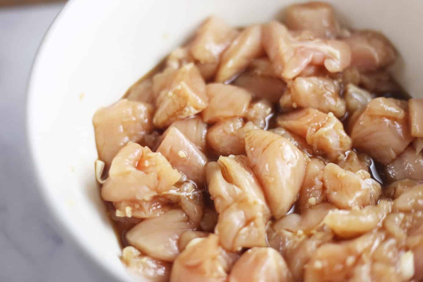 chunks of chicken covered in pineapple sauce marinade