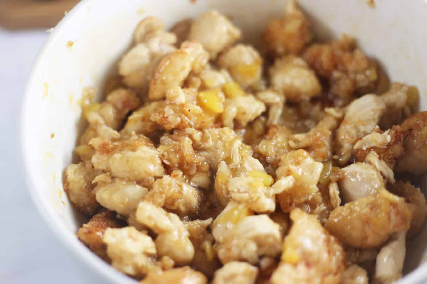 chicken coated with pineapple orange sauce