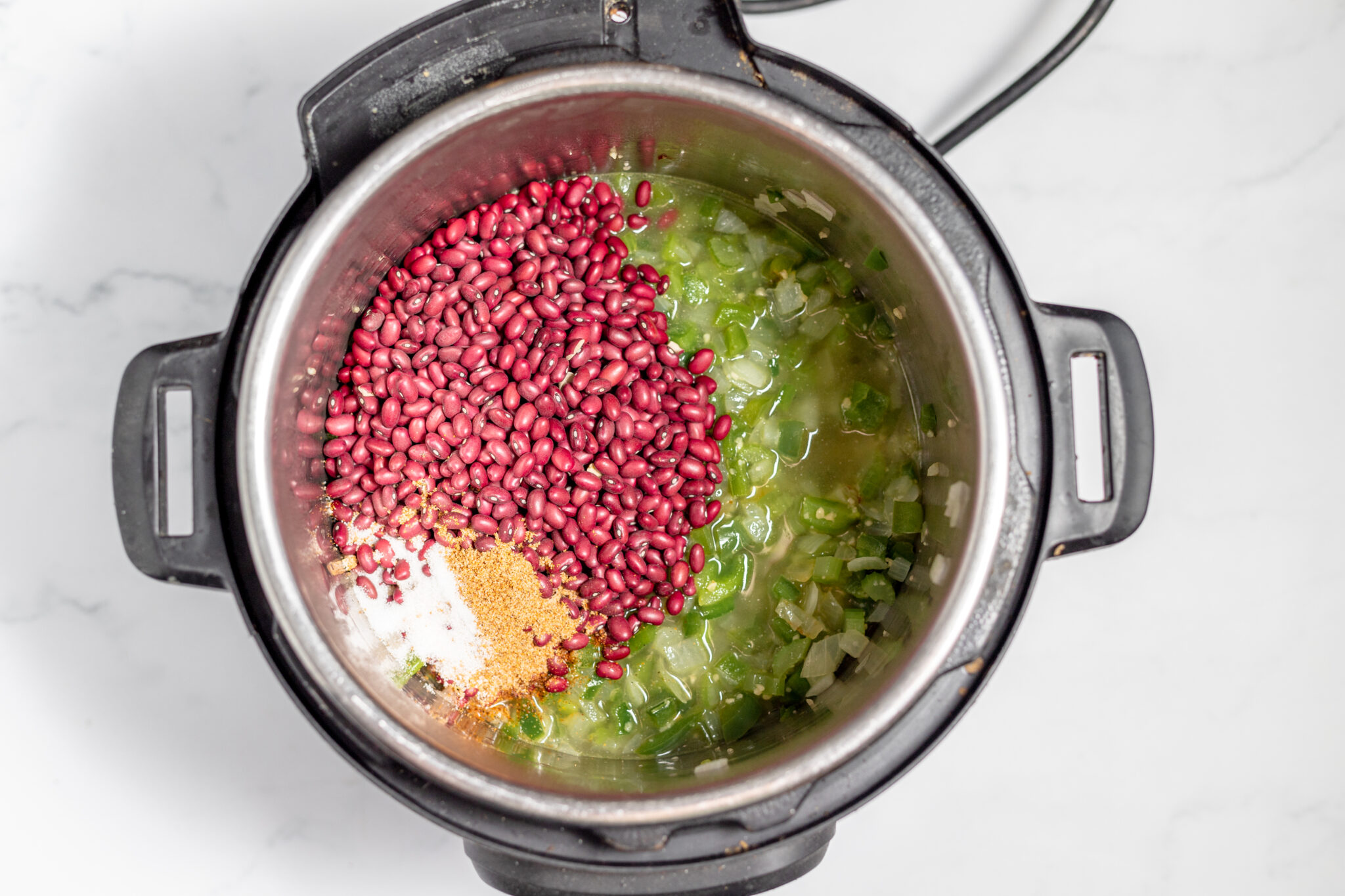 red beans added to instant pot for red beans and rice