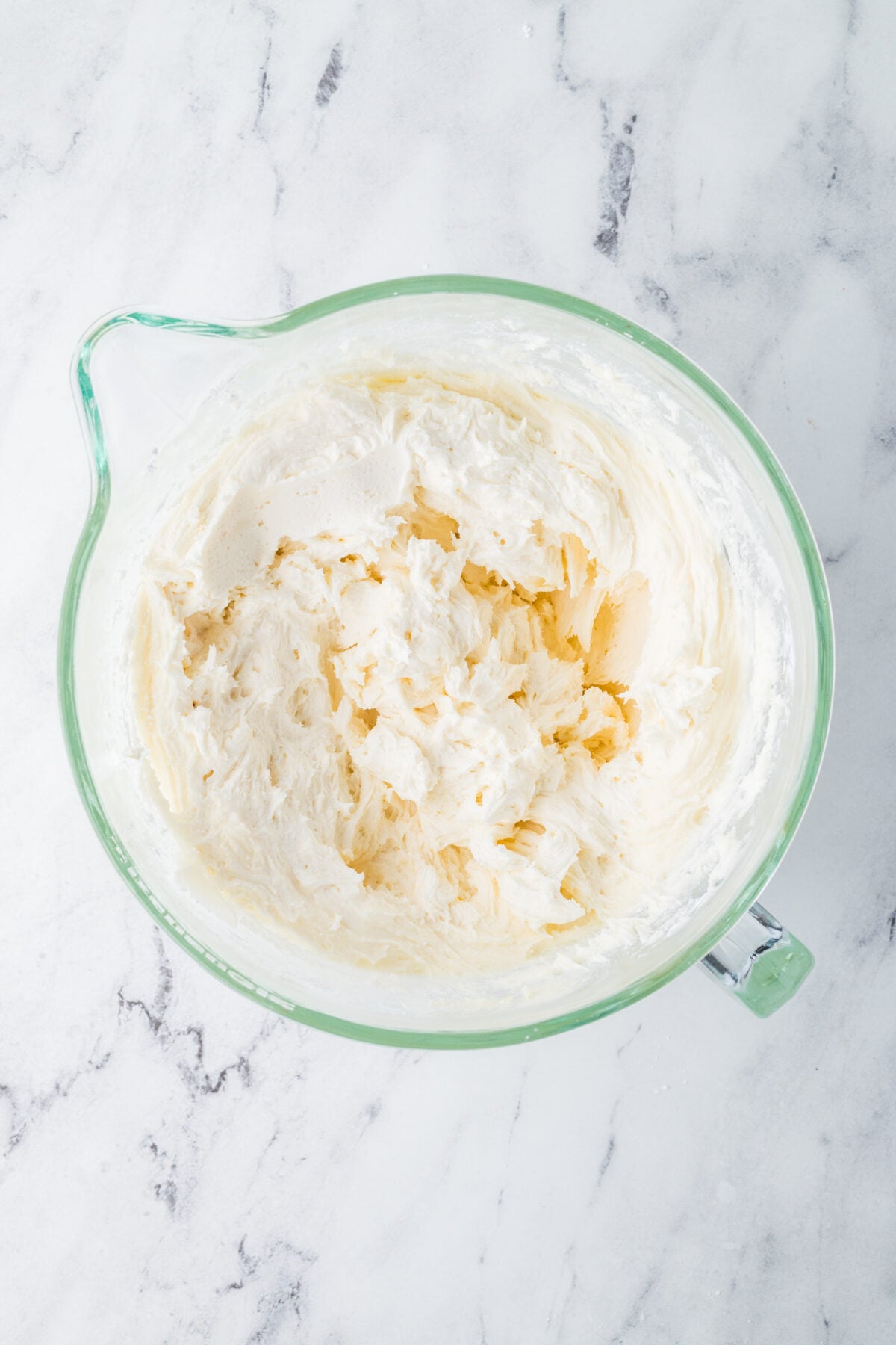 powdered sugar added to cream cheese frosting mixture