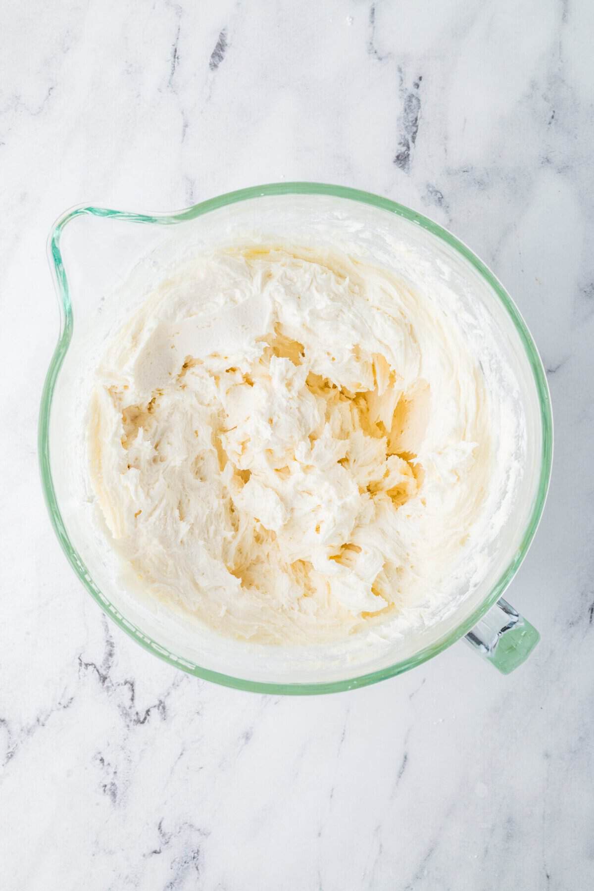 powdered sugar added to cream cheese frosting mixture