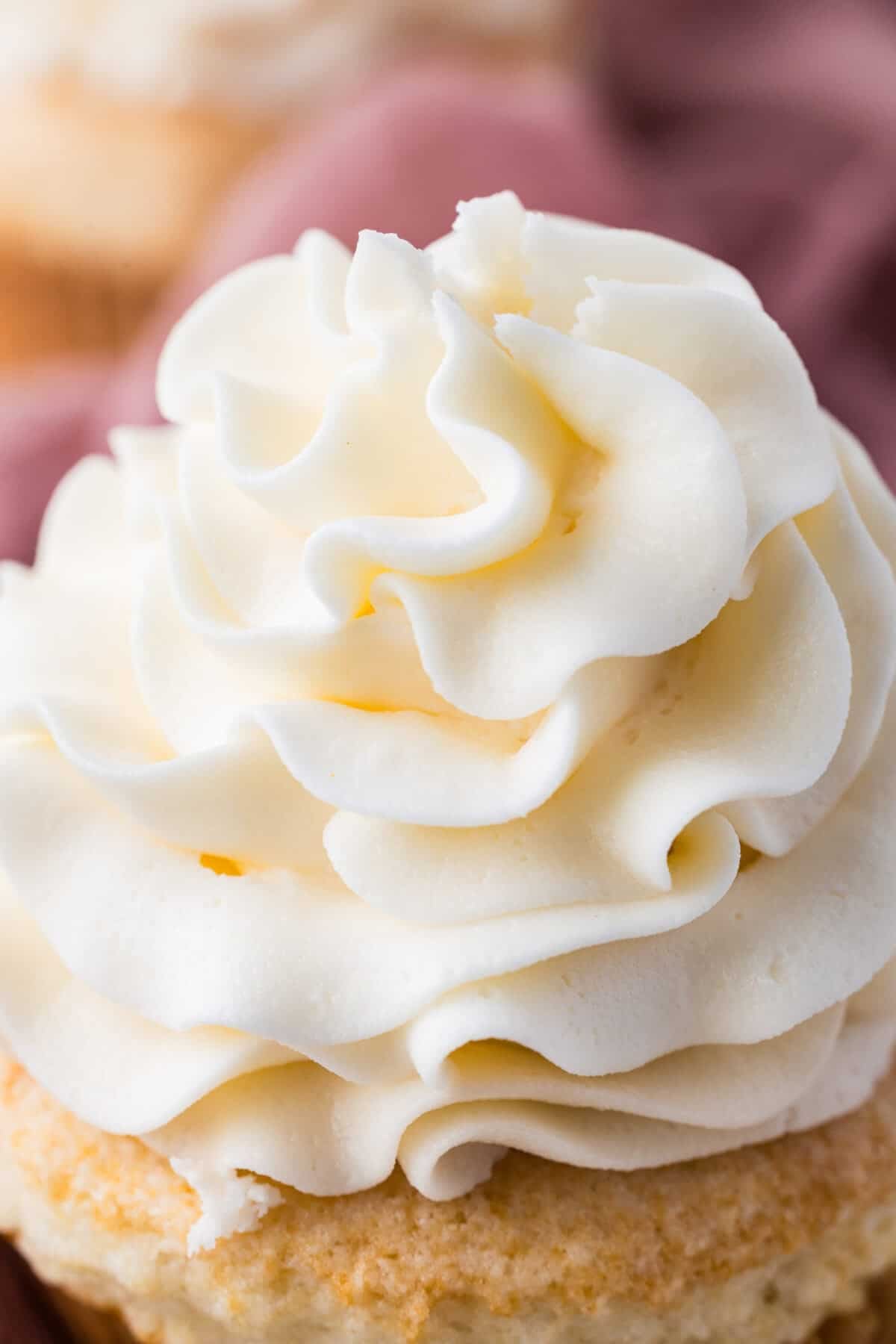 cream cheese frosting on a cupcake