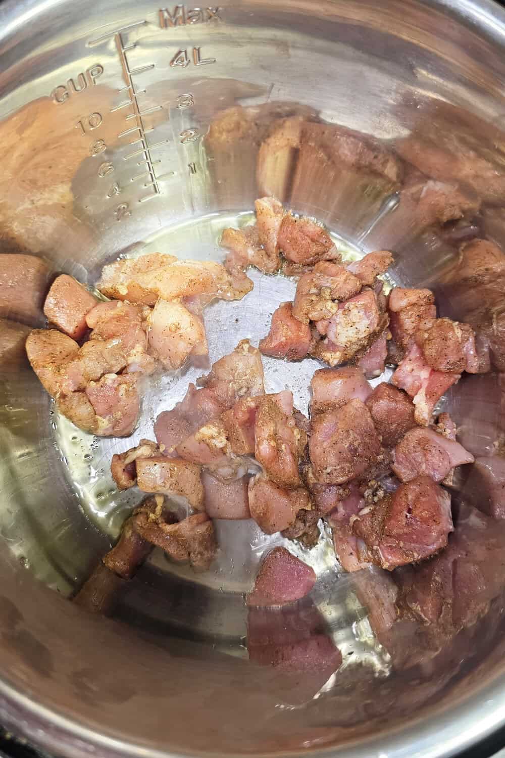 diced chicken thighs cooking in instant pot