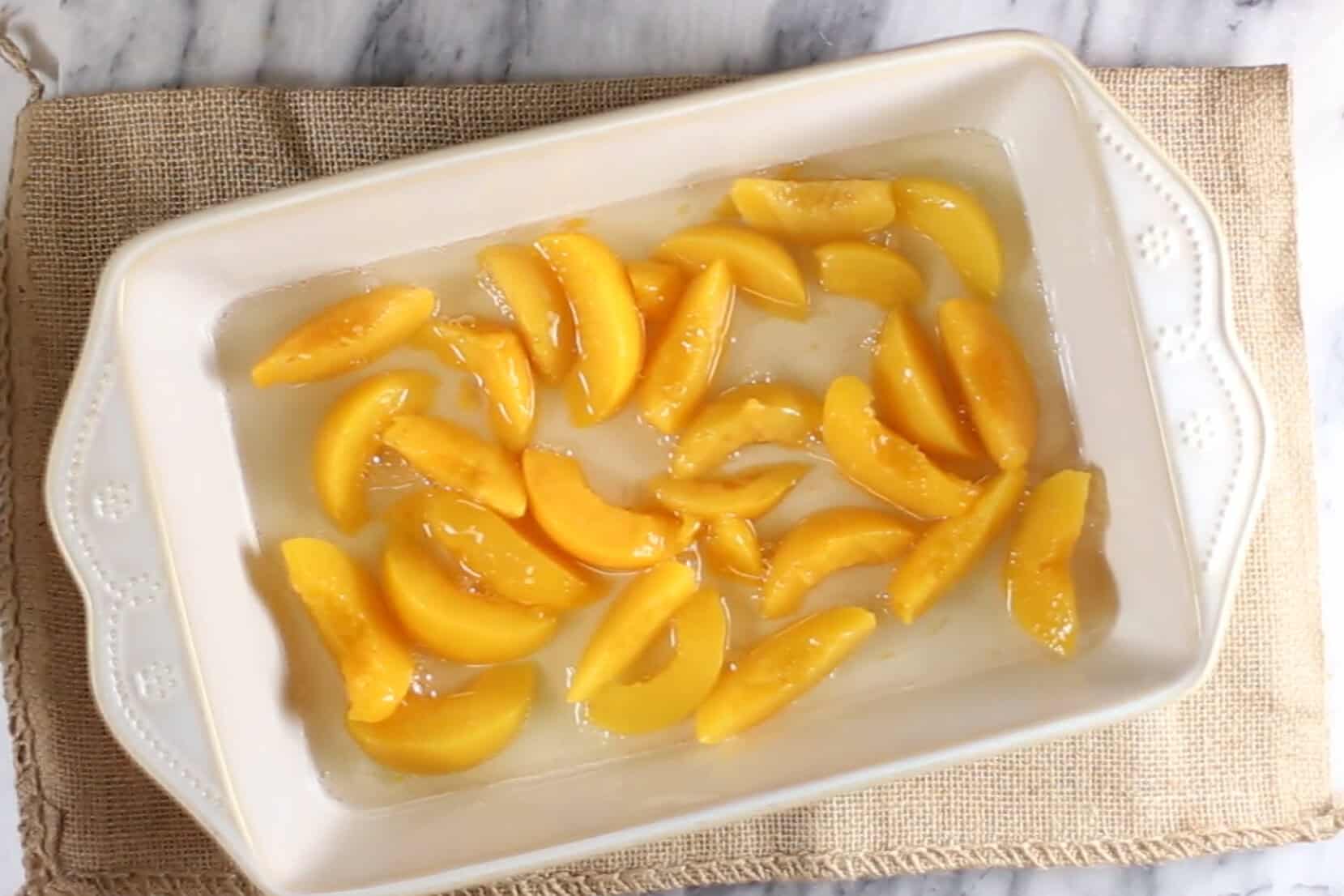 canned peaches poured in a 9x13 baking dish