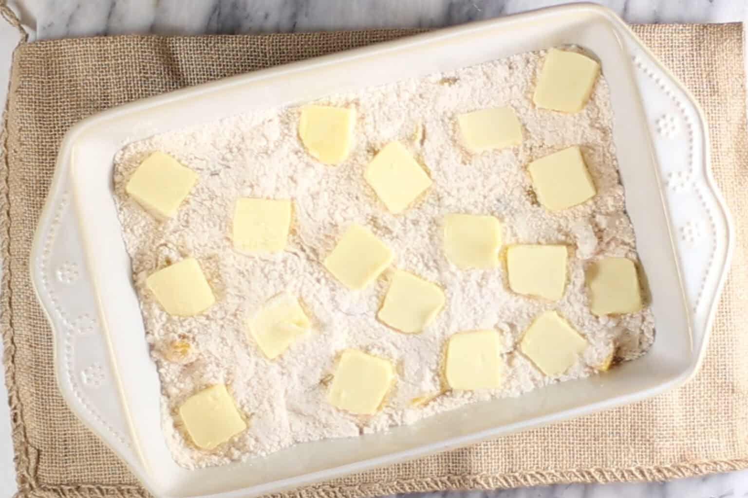 pats of butter over the top of cake mix