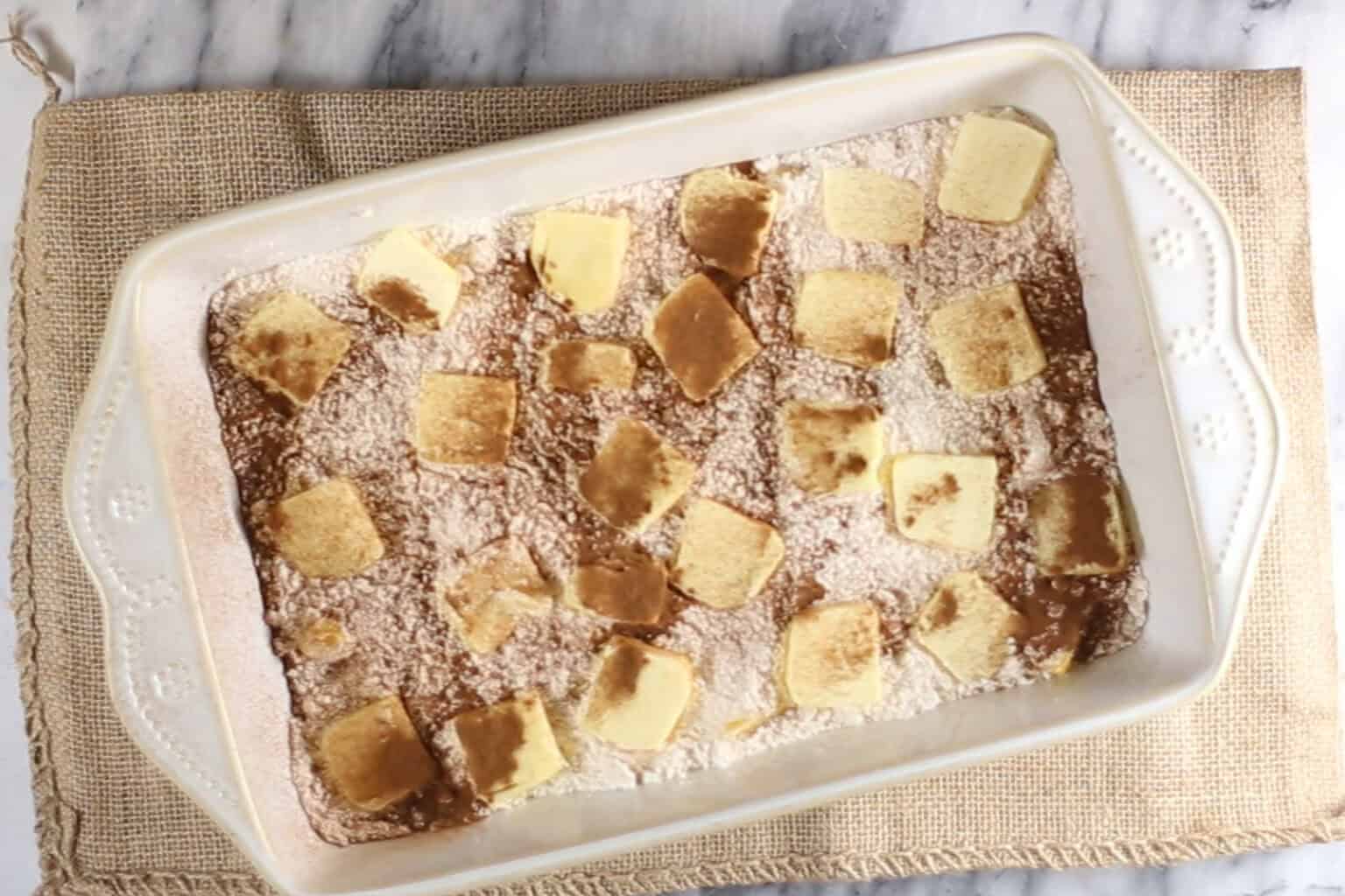 cinnamon over the top of the peach dump cake