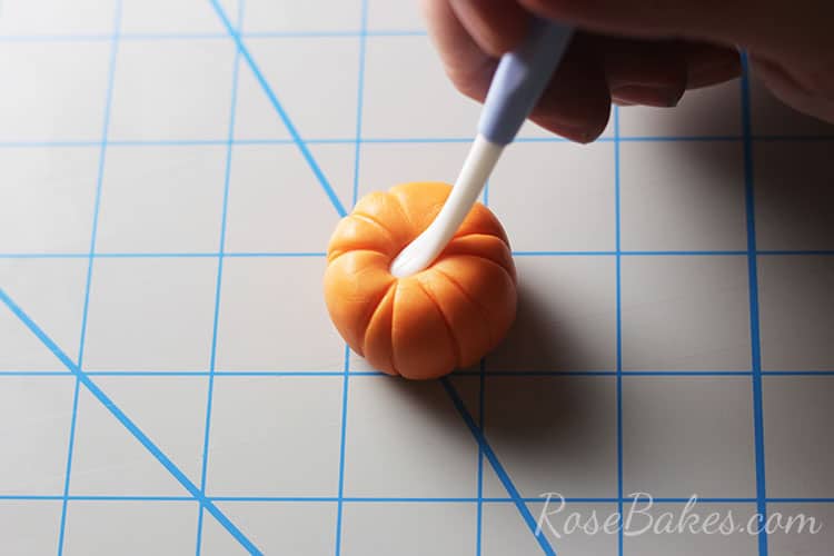 top of cupcake topper being shaped with small ball tool