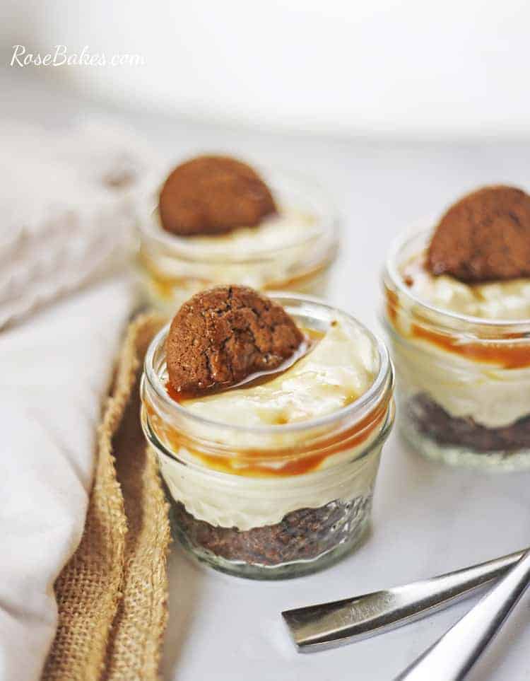 close up of Mini No-Bake Eggnog Cheesecakes with Gingersnap Crust topped with cookie and caramel
