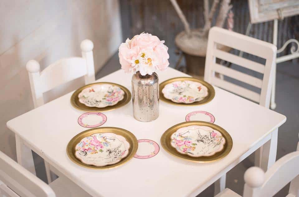 A kids table with decorated plates