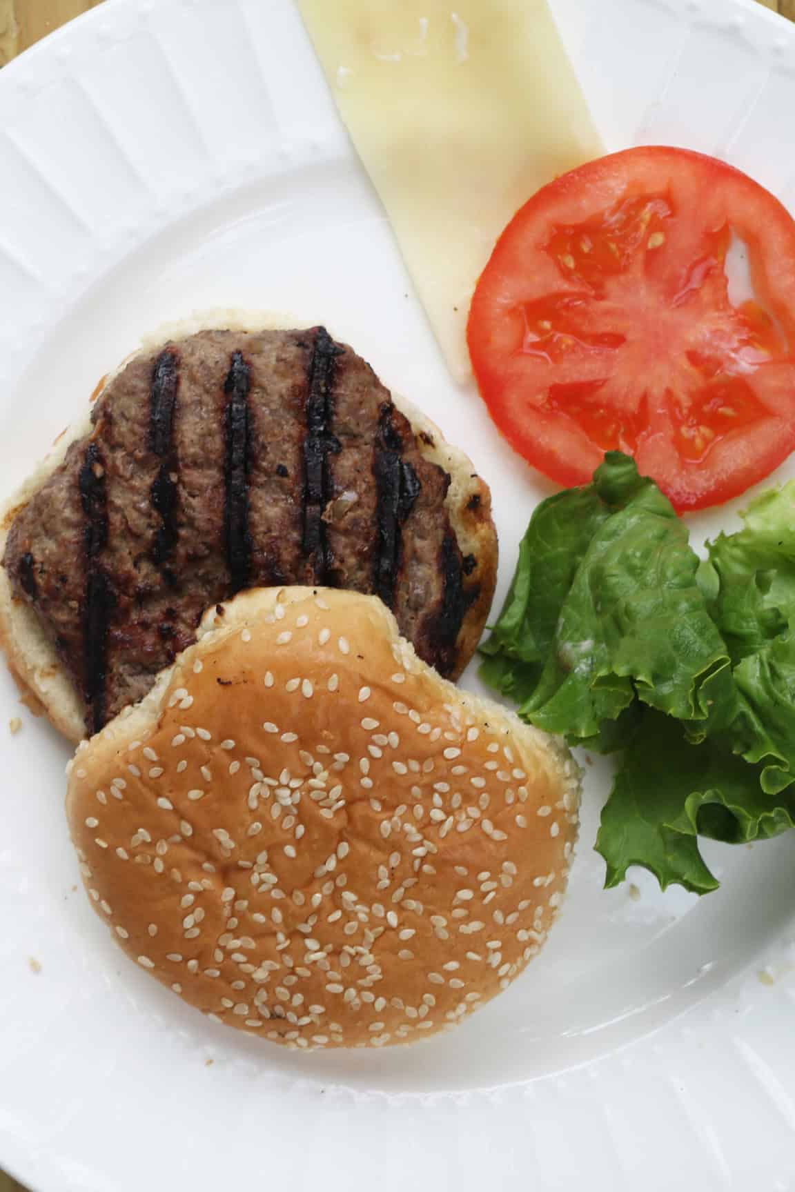 burger on a bun with toppings