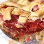Strawberry Rhubarb Pie with a slice missing
