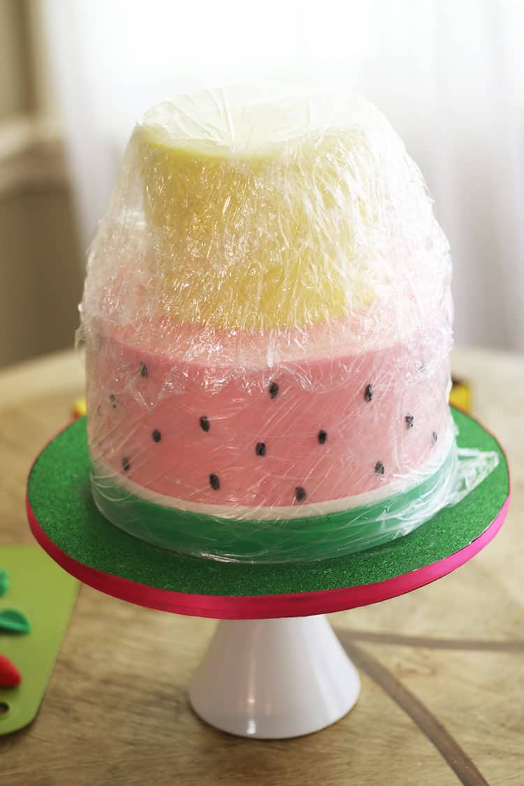 Buttercream Cake wrapped in plastic wrap in preparation for freezing
