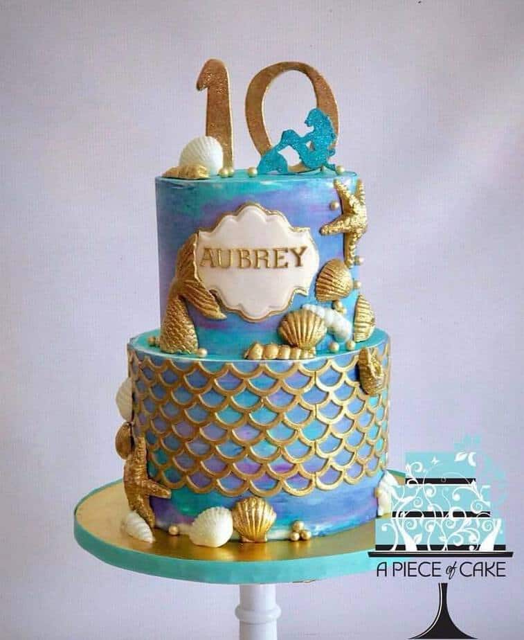 Mermaid Birthday Cake with gold seashells, scales, and mermaid tails