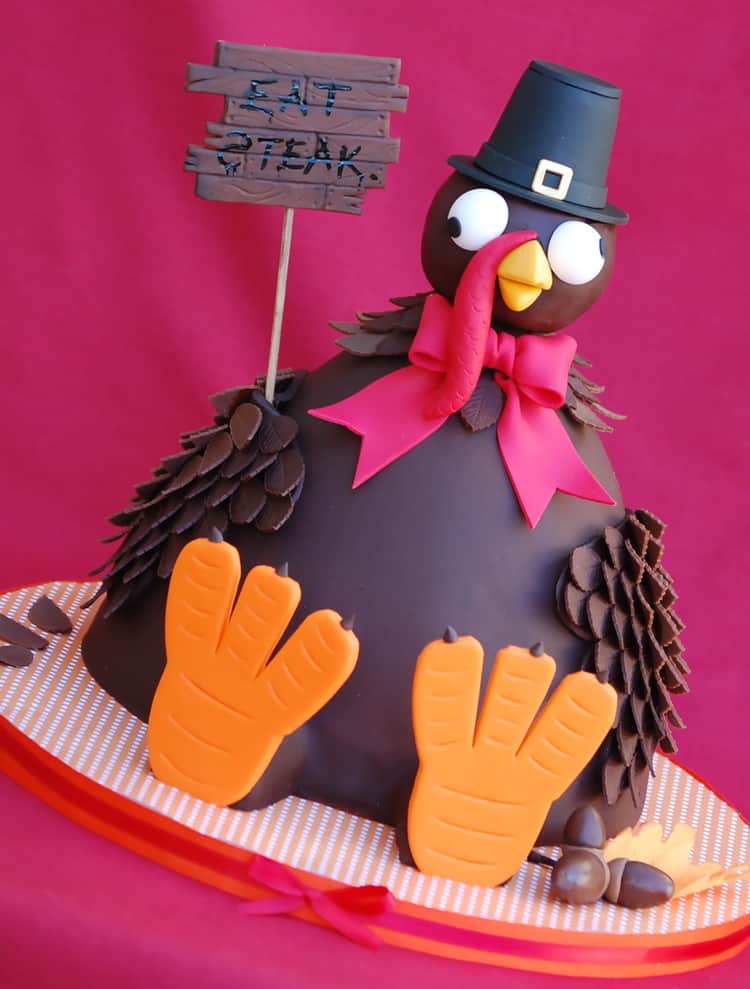 Funny Turkey Cake. Turkey wearing a pilgrim hat and holding a sign that reads "Eat Steak"