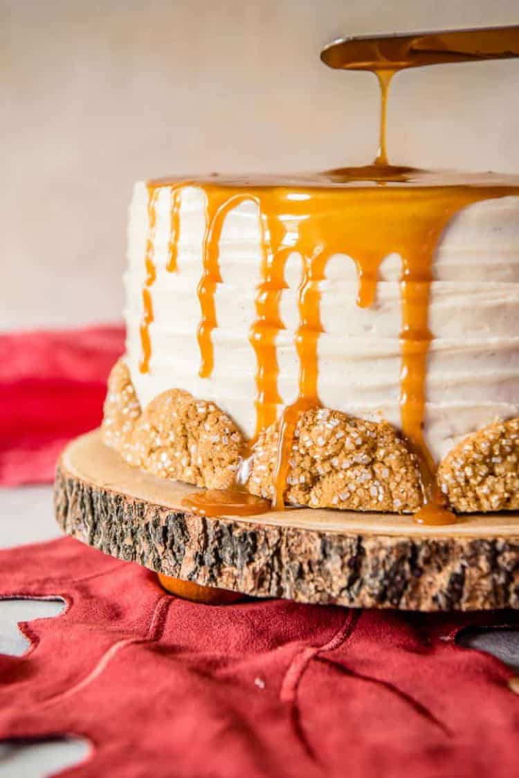 Bourbon Caramel Spice Cake with caramel drip and cookie halves around the bottom.