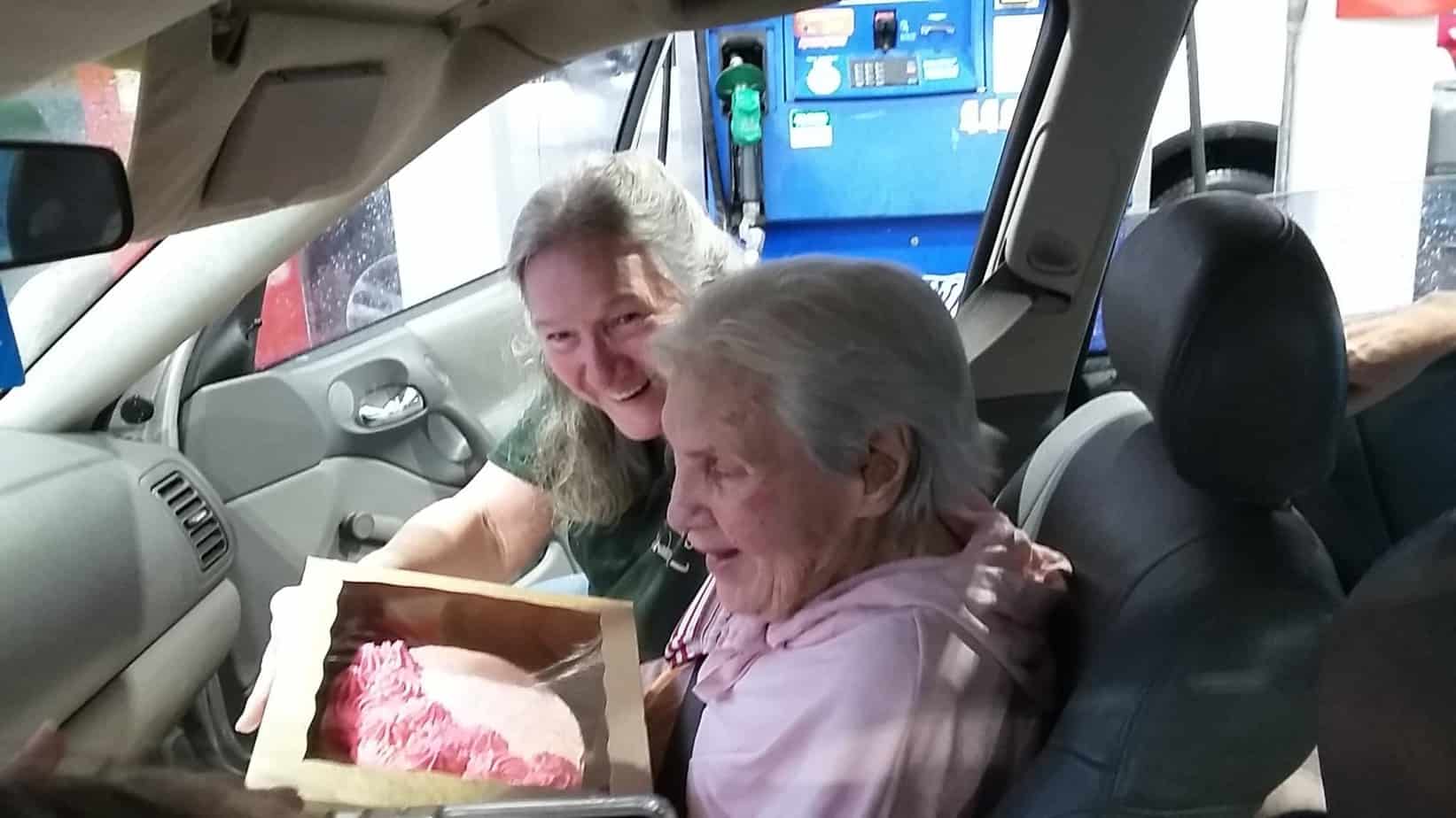 Gladyse holding a cake