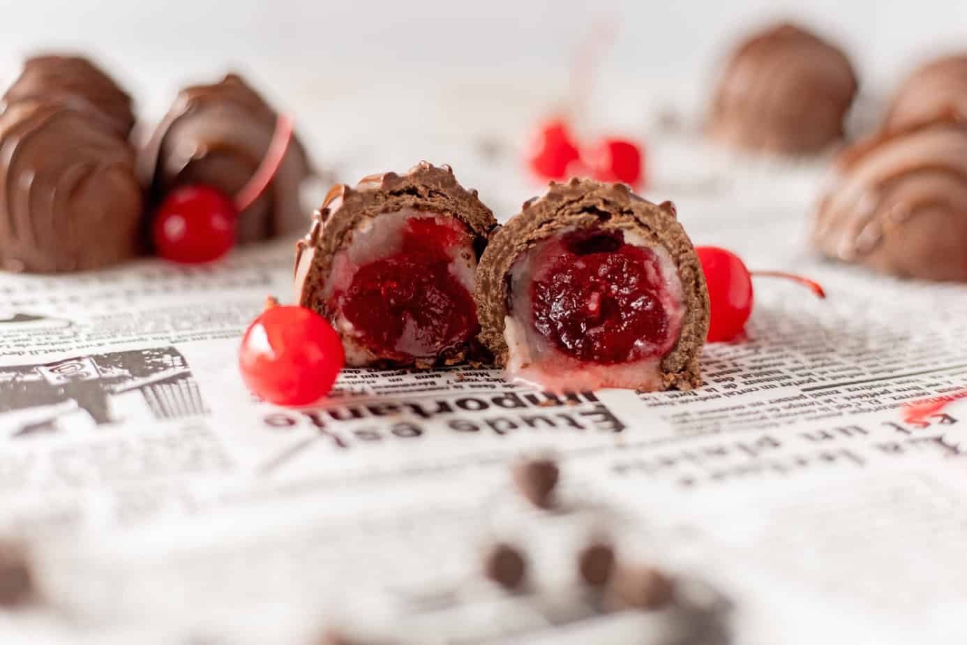 chocolate covered cherries with one cut in half