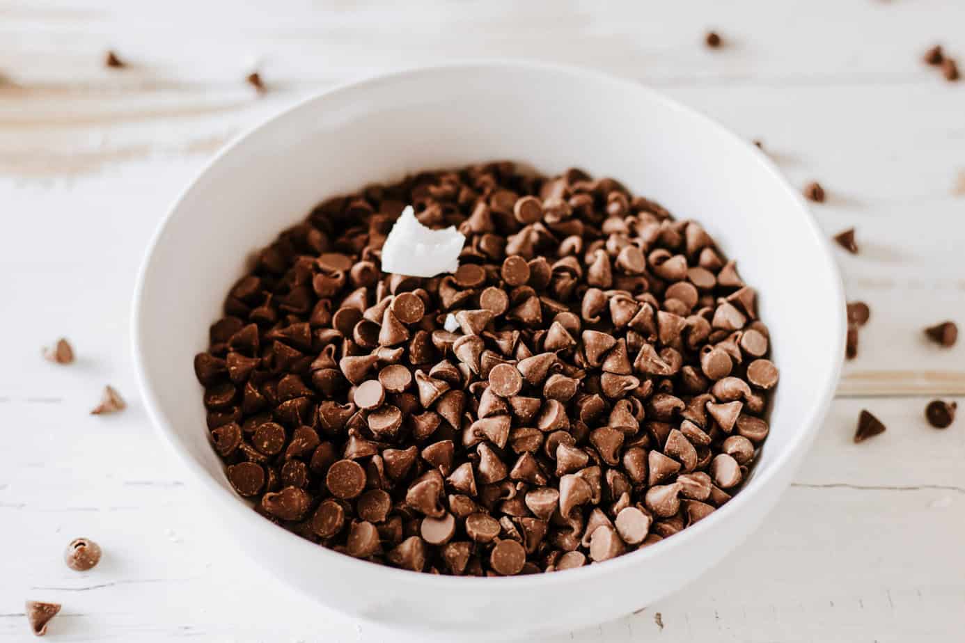 chocolate chips with coconut oil in a microwave-safe bowl