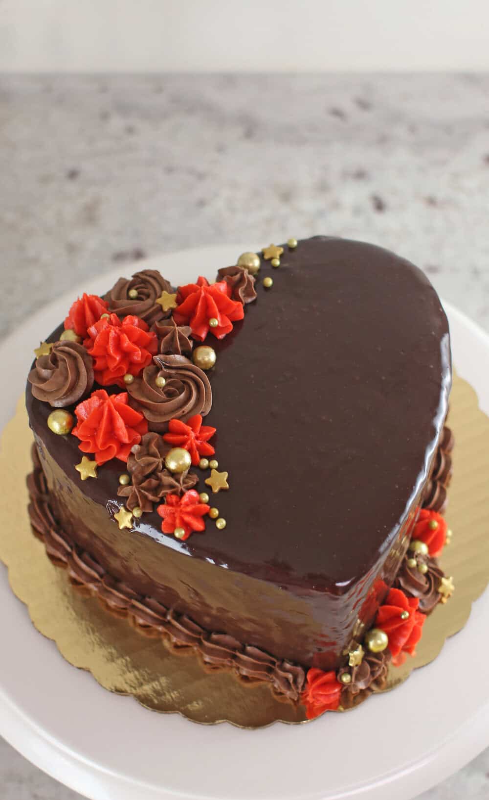 heart-shaped cake covered in ganache