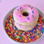 Macrons on top of bowl of sprinkles