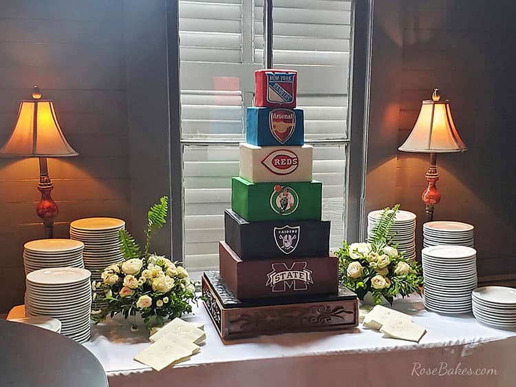 sports themed groom's cake on table with plates