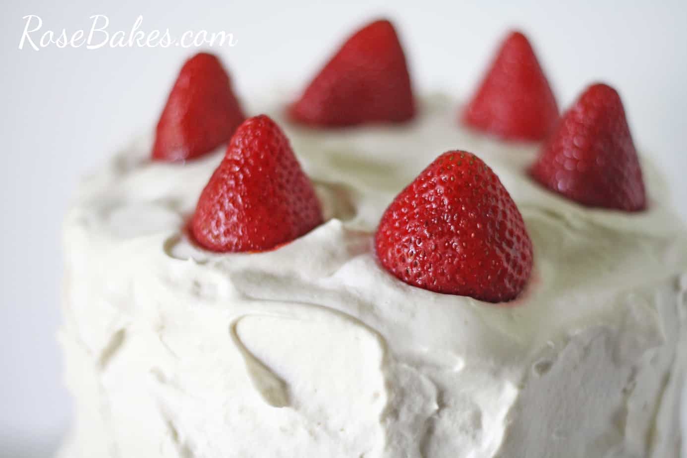 Strawberry Shortcake Cake with Whipped Frosting and Strawberries on Top