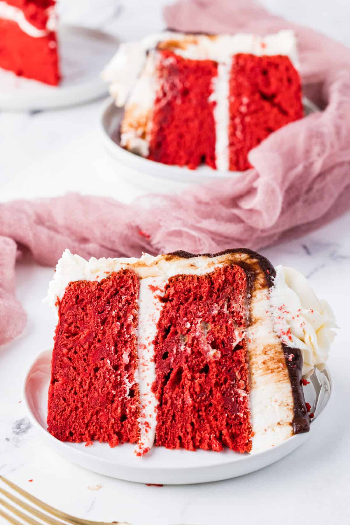 slices of red velvet cake on plates