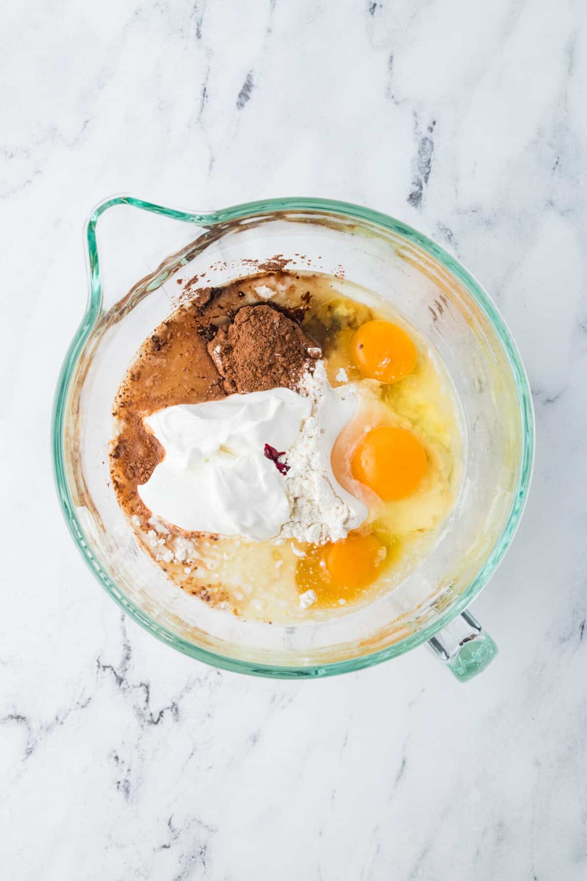 red velvet cake ingredients in a mixer bowl