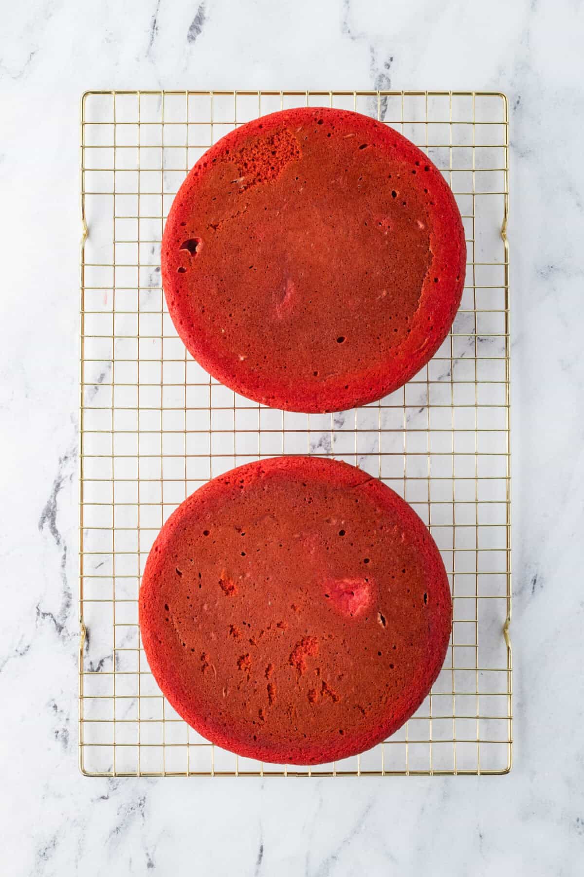 red velvet cake layers on a wire rack 