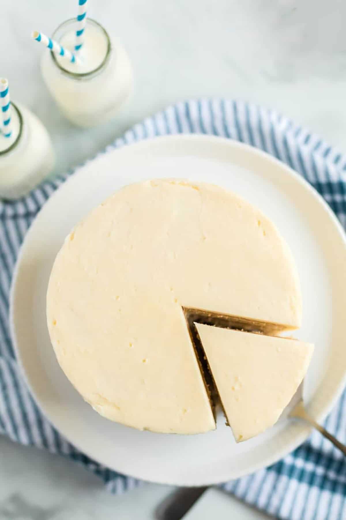 cutting a homemade vanilla cake