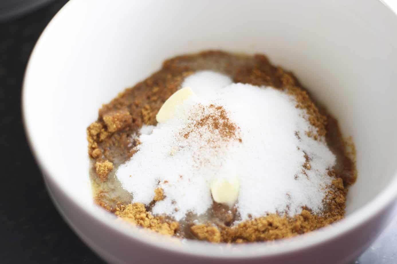 gingersnap crumbs with sugar and butter in white bowl