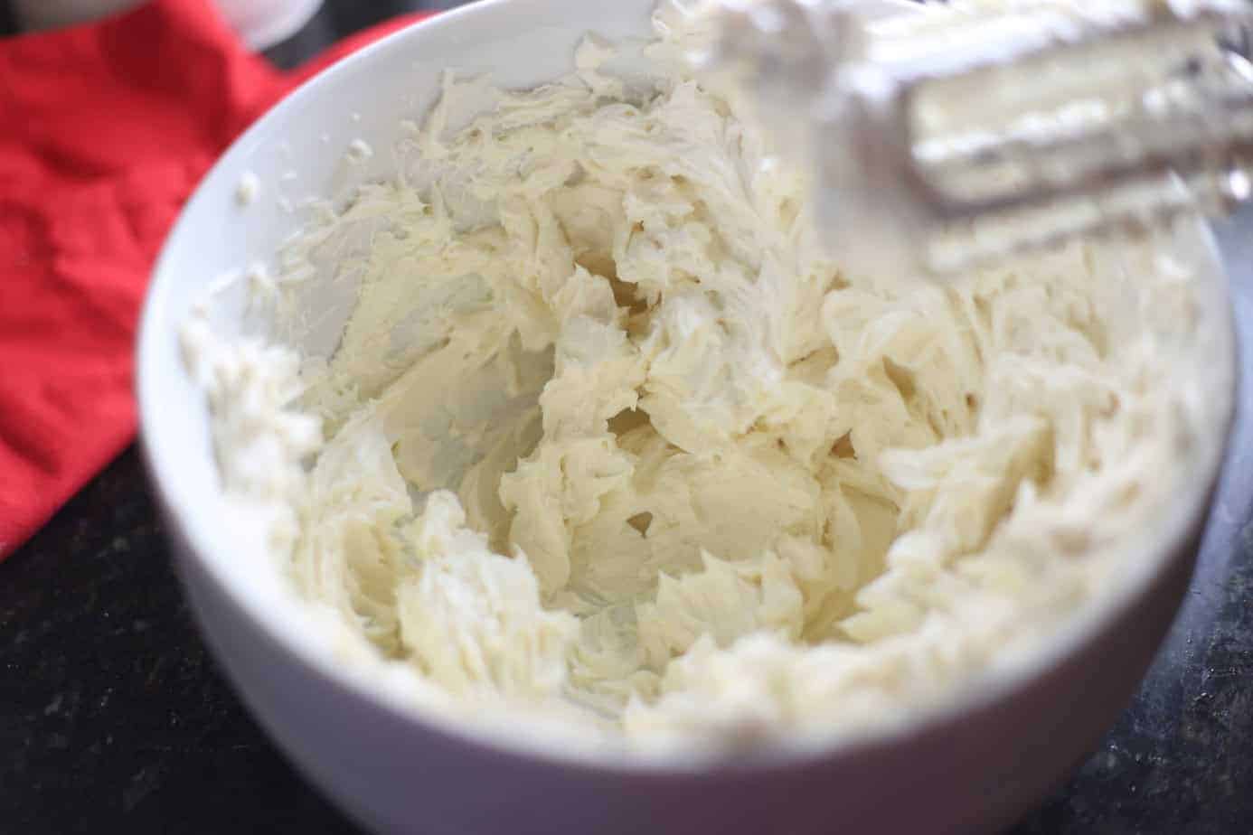 whipping cream cheese in white bowl