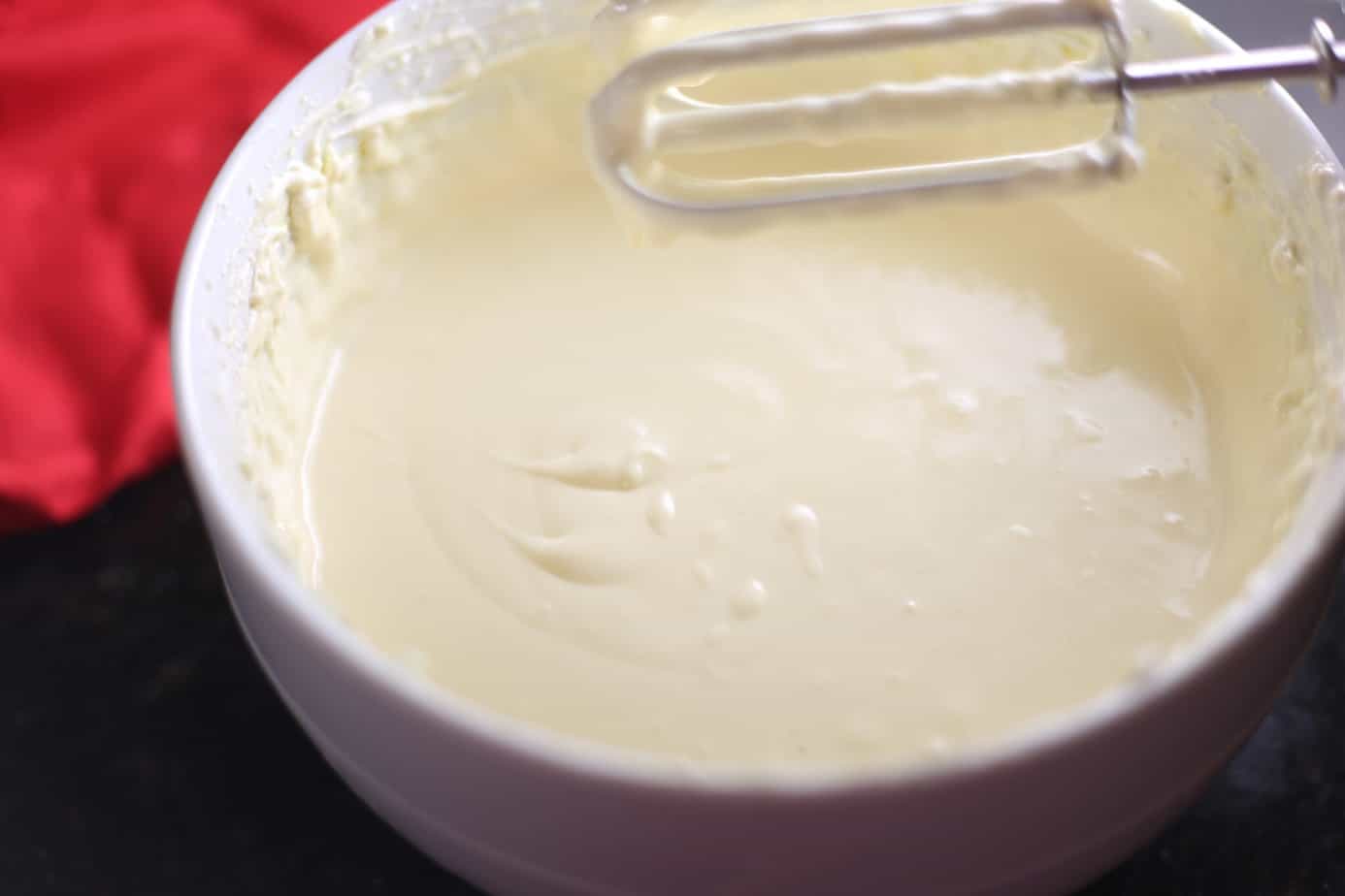 mixing cheesecake filling
