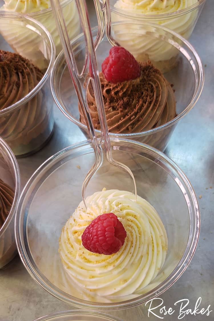 No-bake cheesecakes and no-bake chocolate cheesecakes on cookie sheets with raspberries