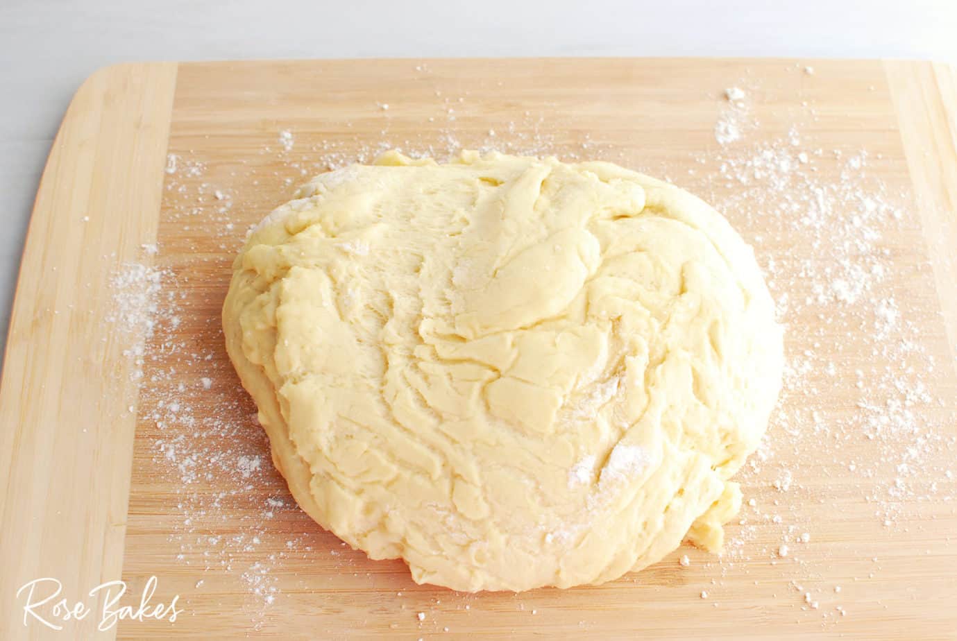 Raspberry Cinnamon Rolls dough ball on cutting board