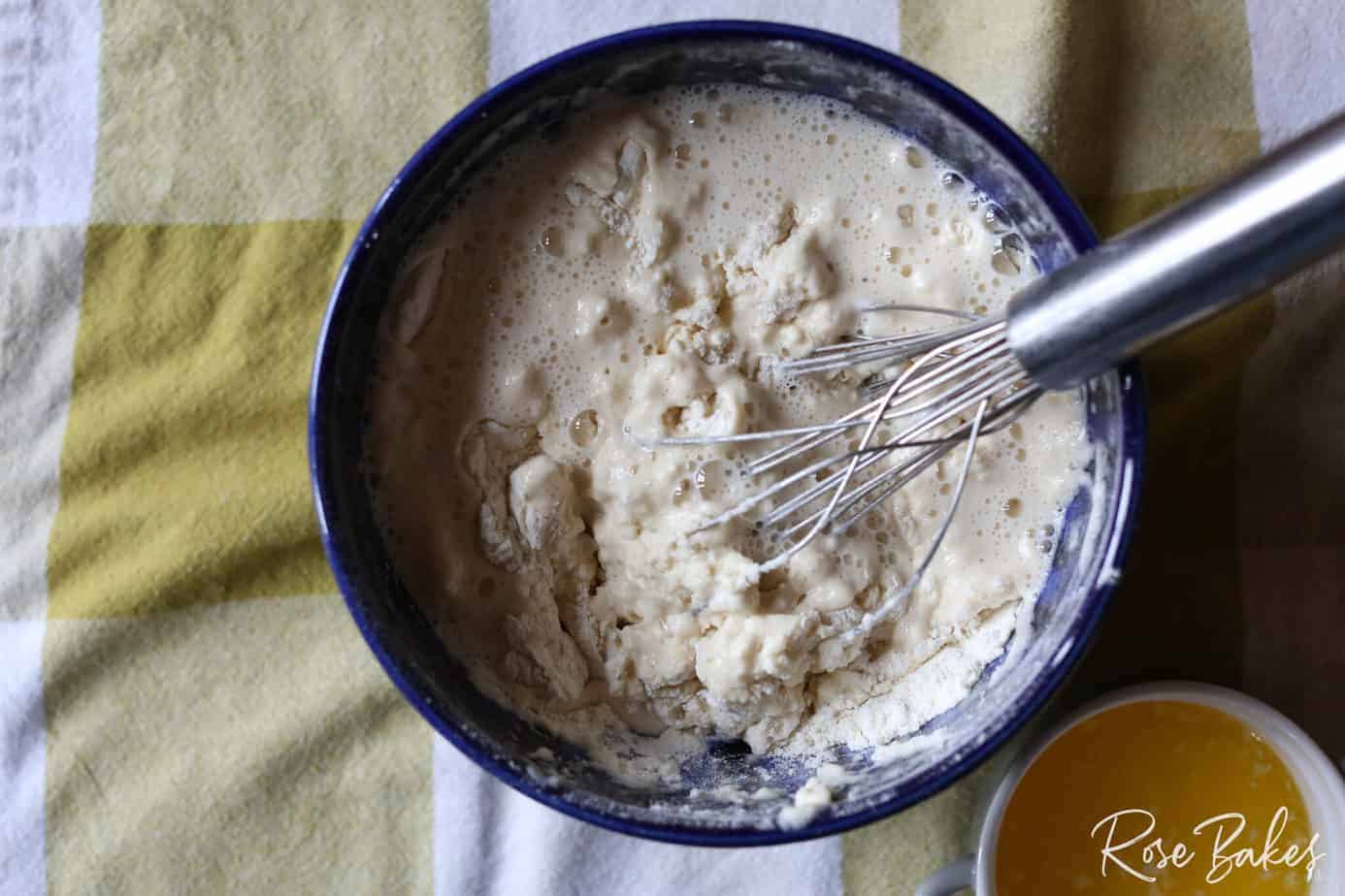 whisking beer and dry ingredients together in bowl