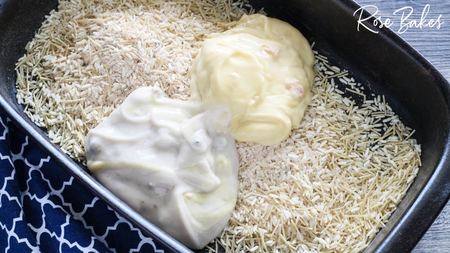 soups and water poured over rice in black dish