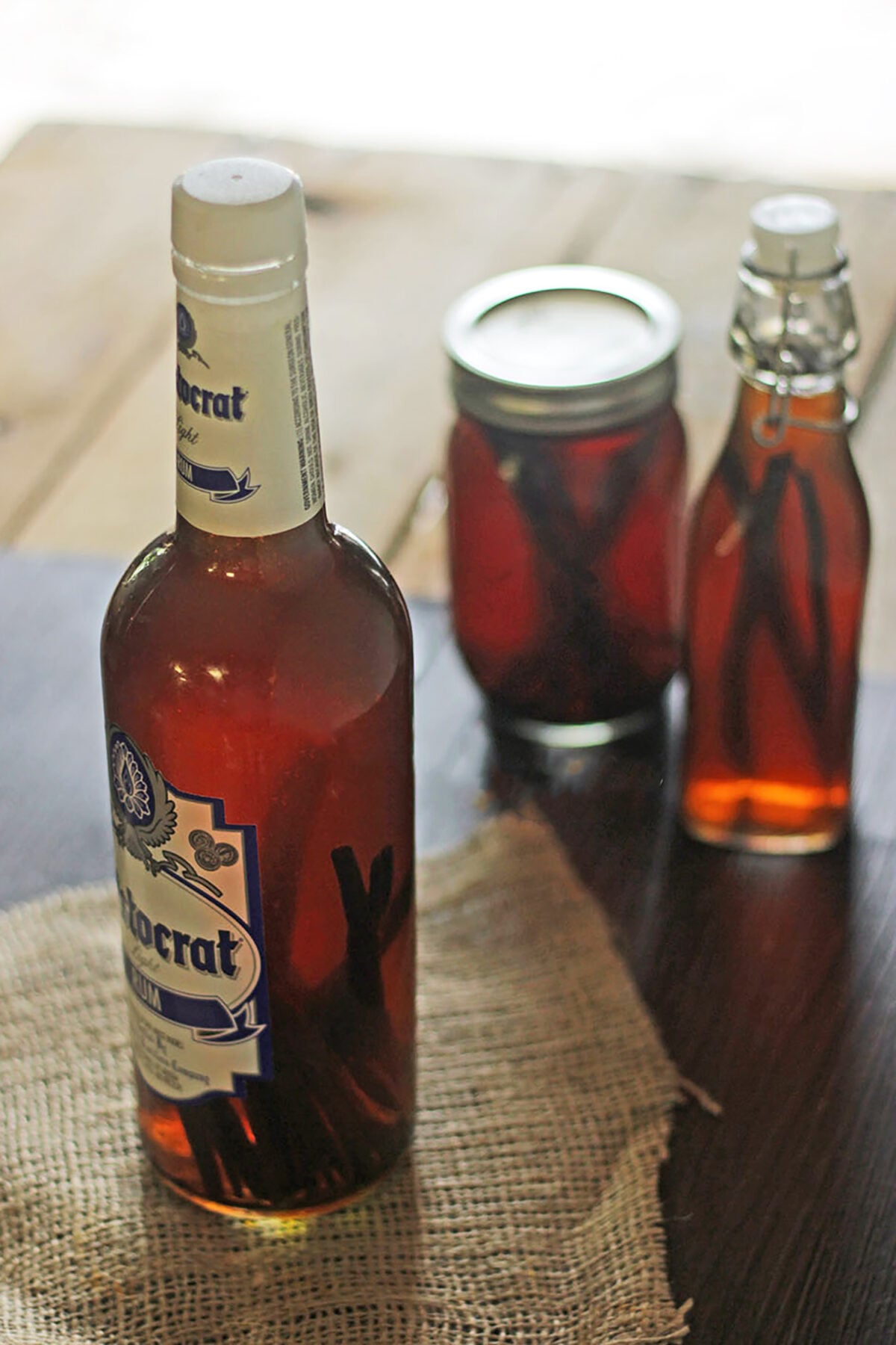 different glass bottles of vanilla extract