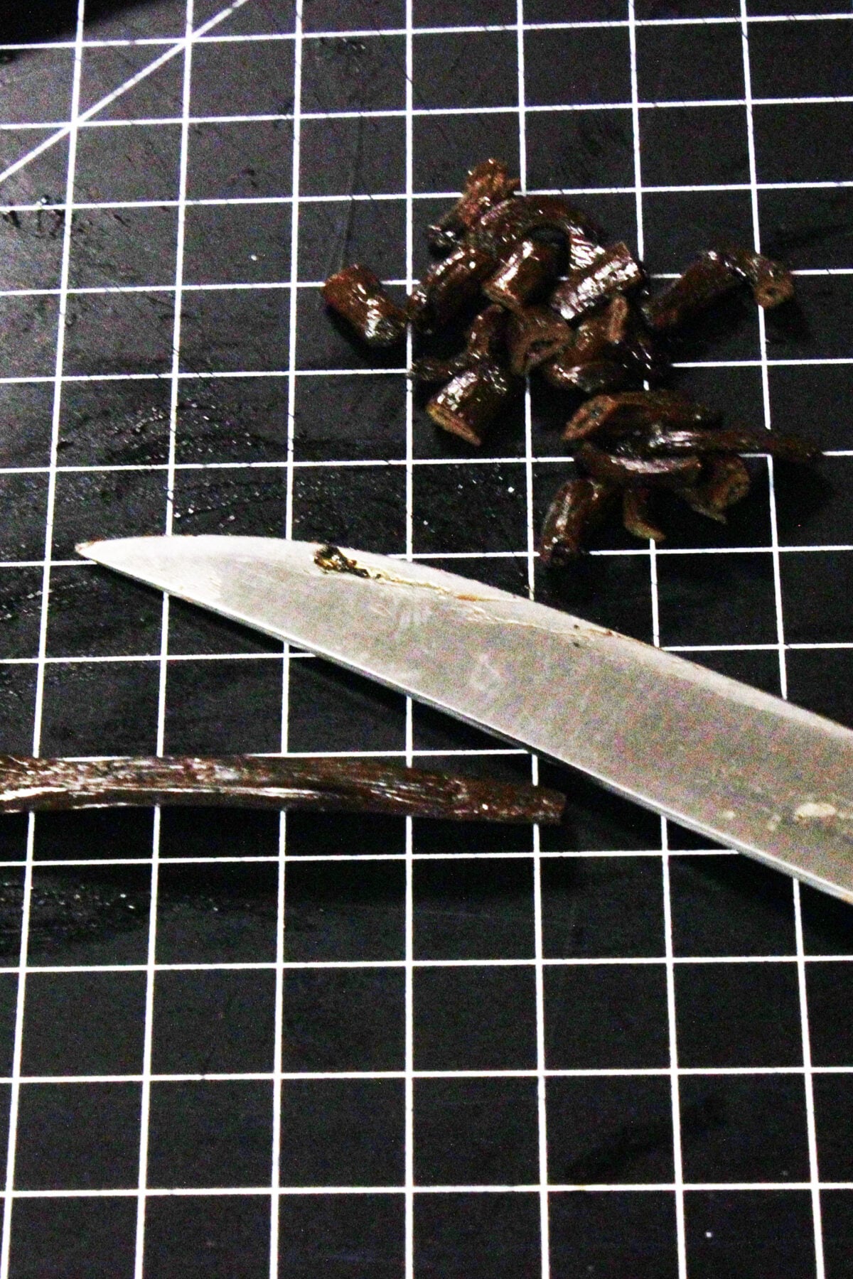 cutting ends off vanilla beans and splitting them